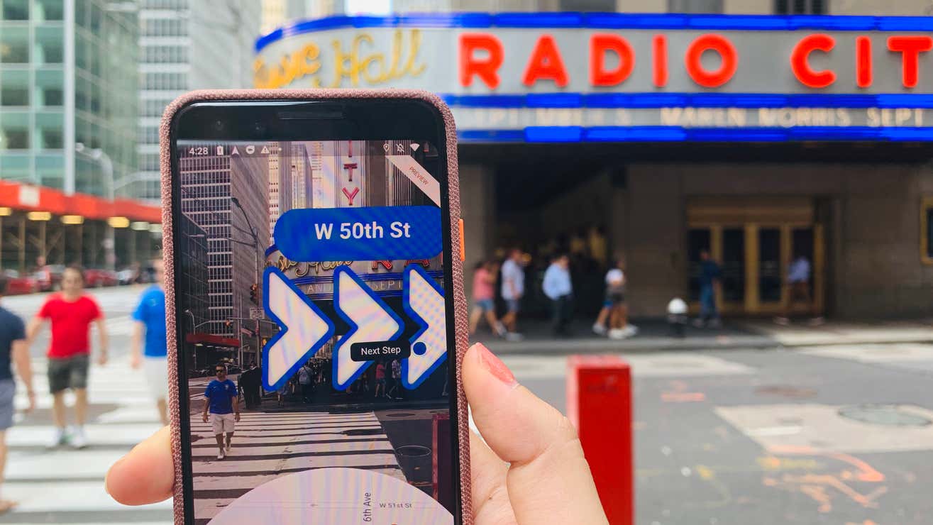 Augmented reality navigation overlay on a phone showing Google Maps AR directions